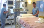 A critical care bed being prepared for the next patient