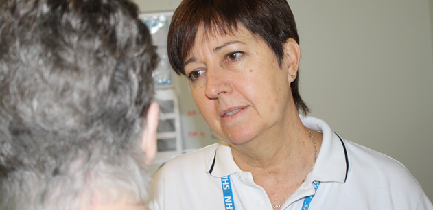 Staff member listening to a patient
