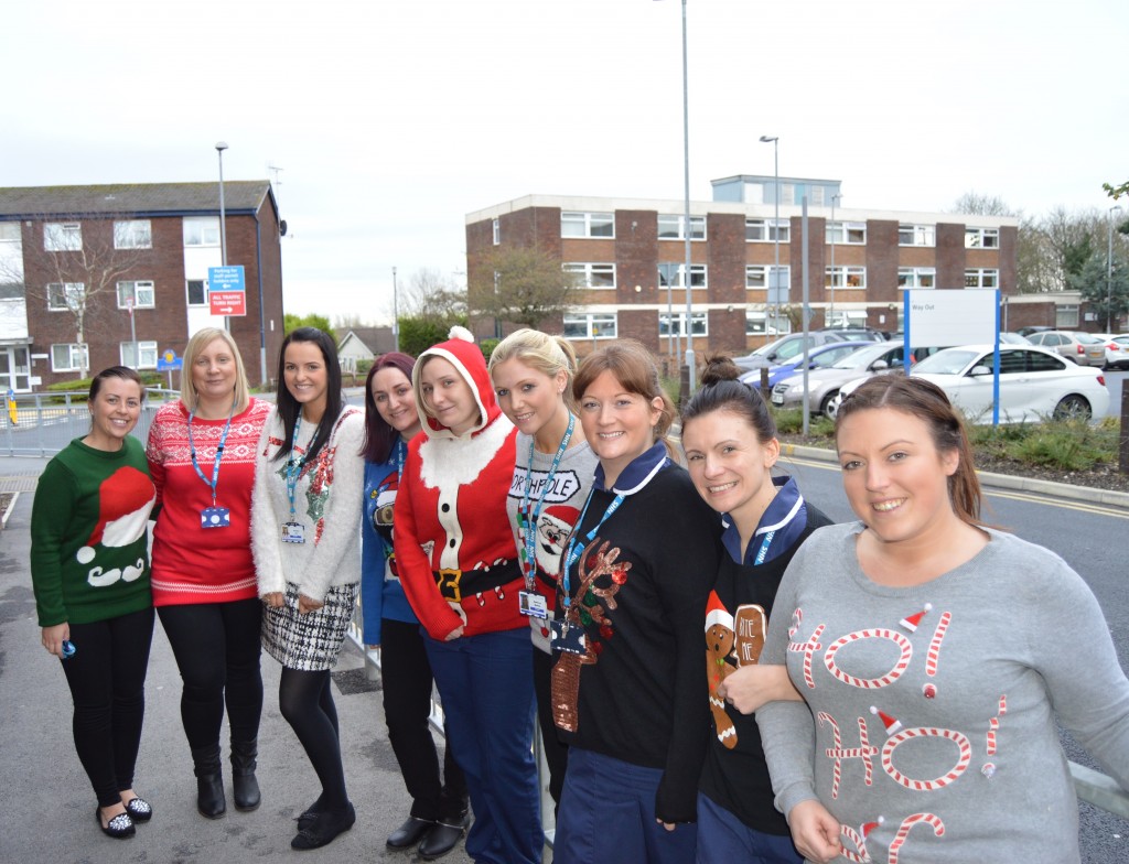 A large group of young women wearing festive jumpers in a variety of styles and colours