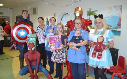 children and nurses with three superheroes spiderman iron man and captain america