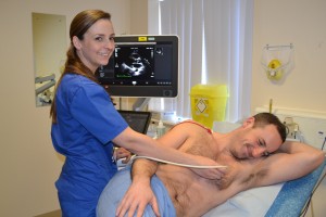 A medic using heart monitoring equipment