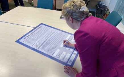 Chief Exec, Tricia Armstrong-Child, signing the NHS Smokefree Pledge