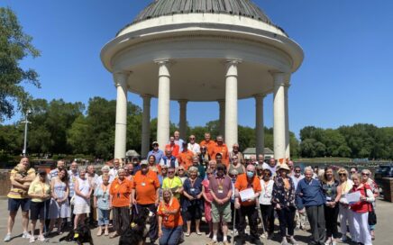 Large group of volunteers at picnic in the park event