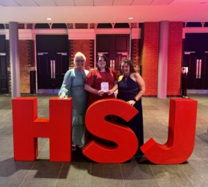 A photo of colleagues from Blackpool Teaching Hospitals celebrate being named as a highly commended finalist for an HSJ Patient Safety Award.