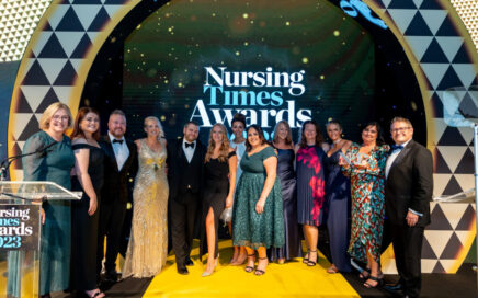 Trust colleagues receiving their award on stage at the Nursing Times Awards